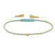 Bracelet Lien Tréssé Rond Bicolore Lurex Doré et Une Perle Or 14 Carats