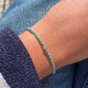 Bracelet Lien Tréssé Rond Bicolore Lurex Doré et Une Perle Or 14 Carats
